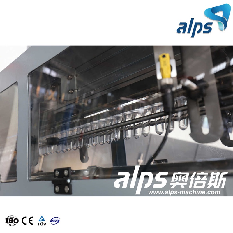Combiblock with PET Preforms – Heating and Blowing Section in Water Bottling Line Combiblock with PET Preforms – Heating and Blowing Section in Water Bottling Line