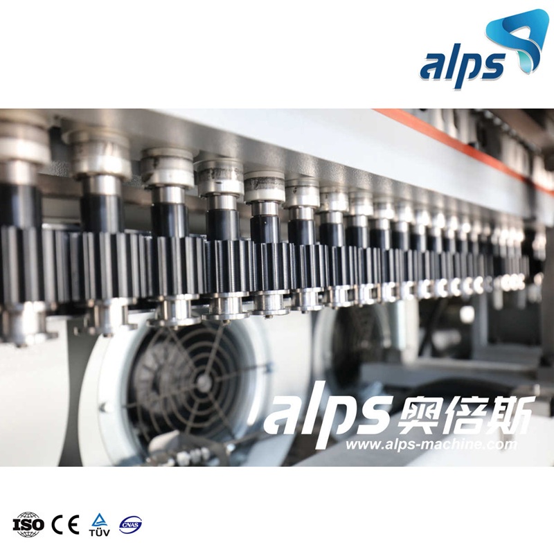 Combiblock Machine – Precision Gears and Filling Heads in Action Combiblock Machine – Precision Gears and Filling Heads in Action