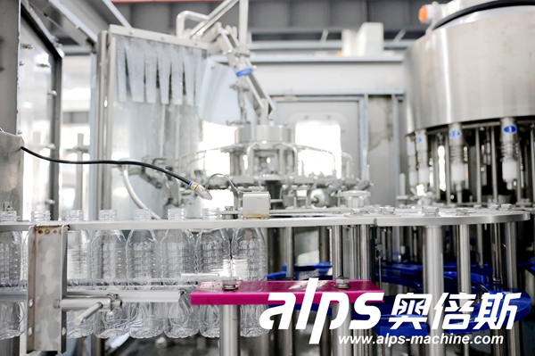 Water Production Line – PET Bottles on Conveyor Before Capping Water Production Line – PET Bottles on Conveyor Before Capping