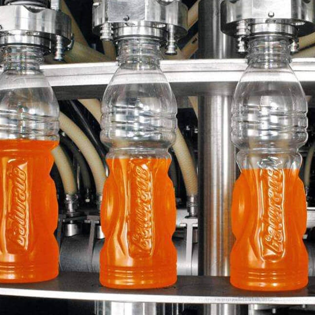 How is orange juice in factories made?